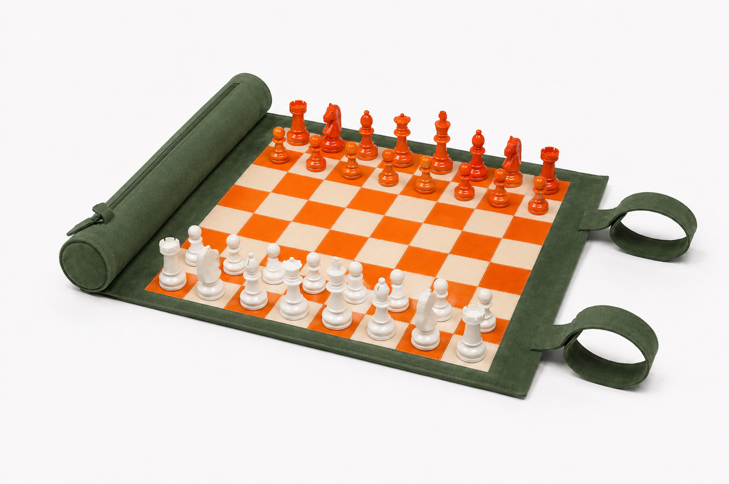 Portable Eire leather chess board rolled open with orange and ivory chess pieces