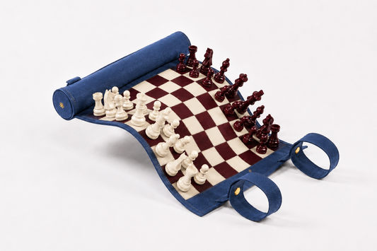 Roll-Up Magnetic Leather Chess Set Les Bleus in blue nubuck leather with burgundy and ivory magnetic chess pieces