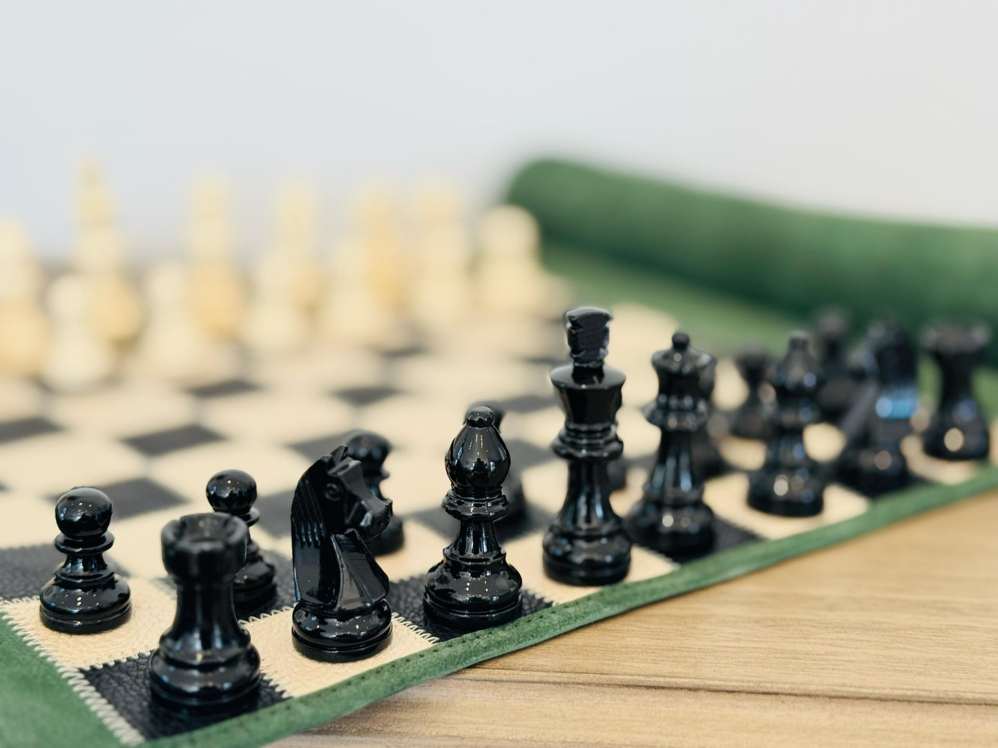 Close-up of hand-lacquered magnetic chess pieces on the Genève edition