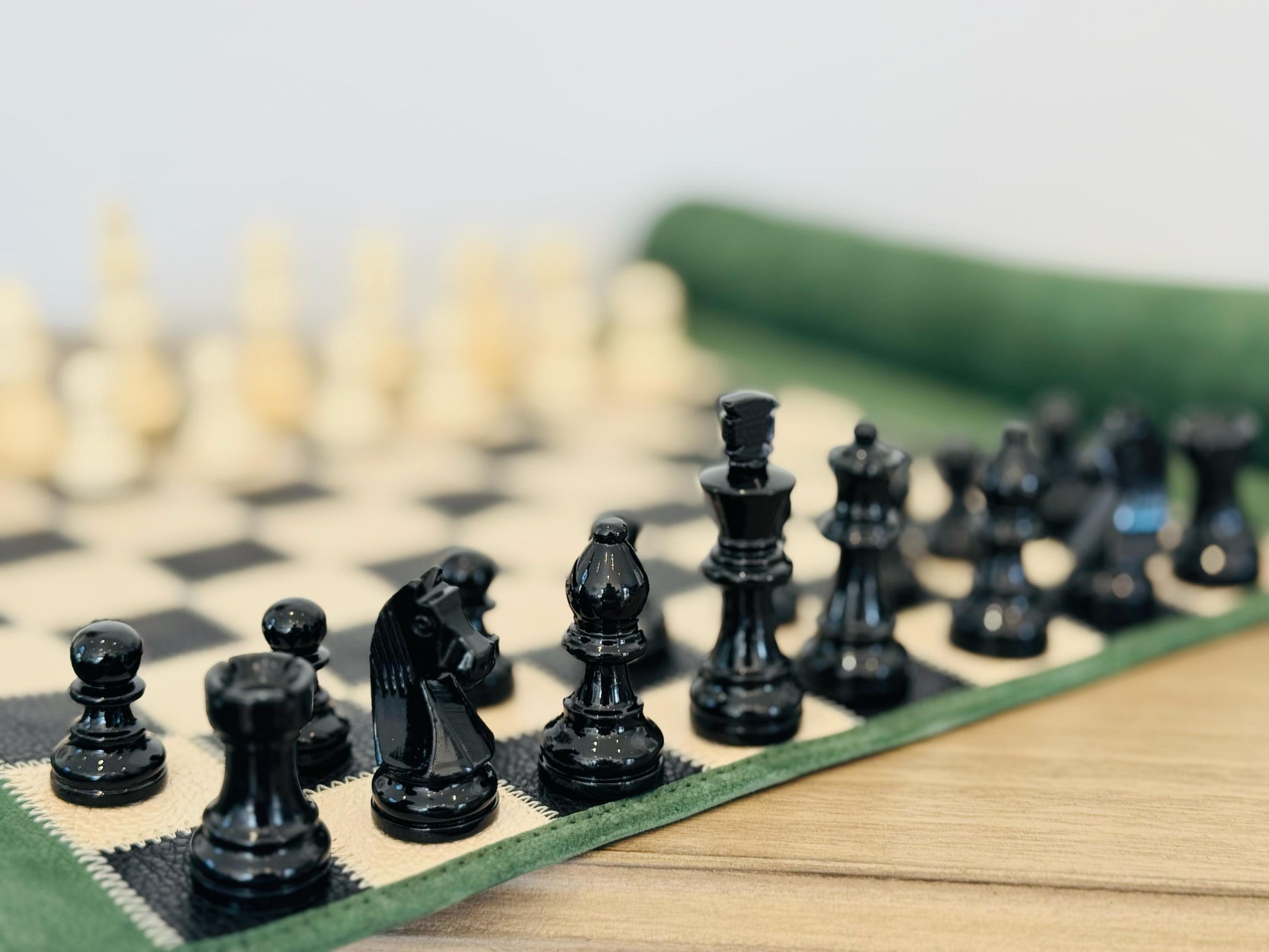 Close-up of hand-lacquered magnetic chess pieces on the Genève edition