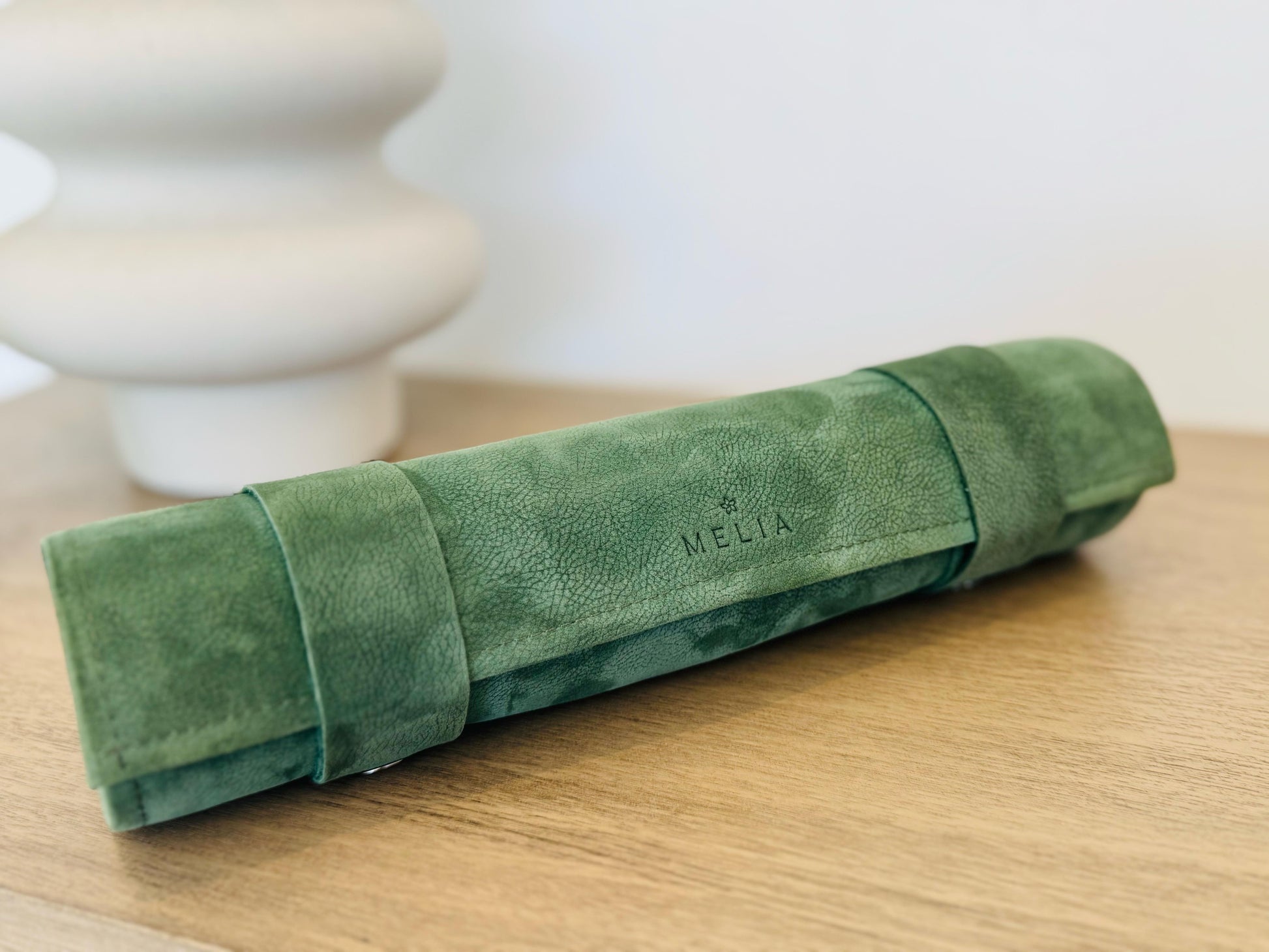 Genève magnetic leather chess set rolled into its compact leather case