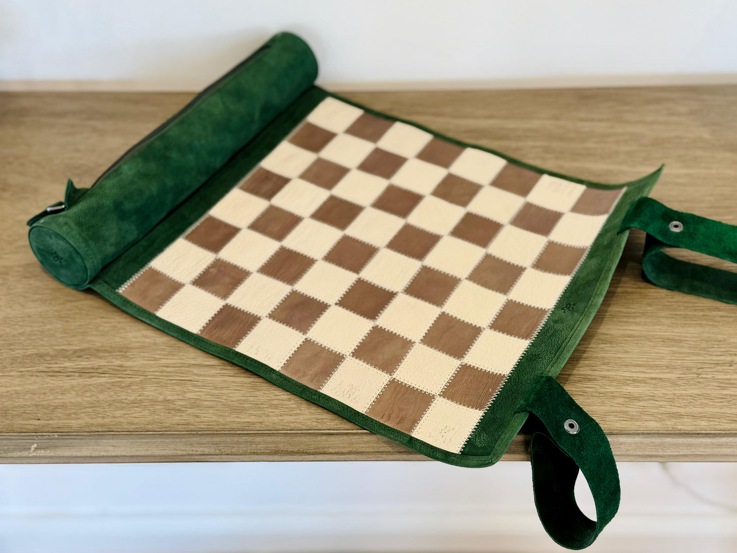 Folded Grande Dame magnetic leather chess set with leather carrying strap