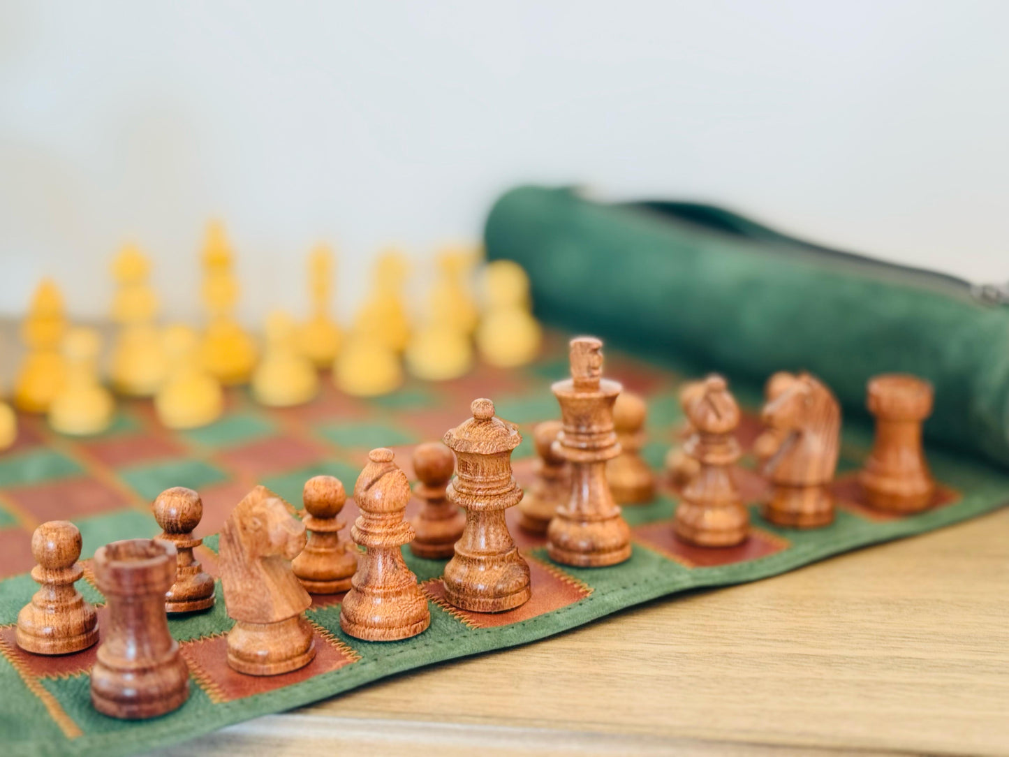 Close-up of handcrafted magnetic wooden chess pieces on the Hunter edition