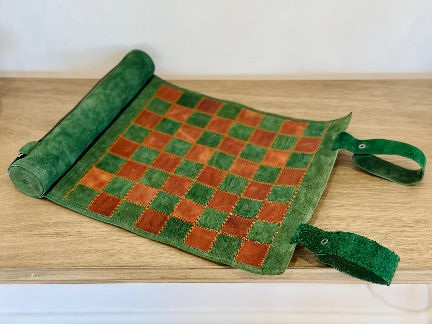 Folded Hunter magnetic leather chess set with leather carrying strap