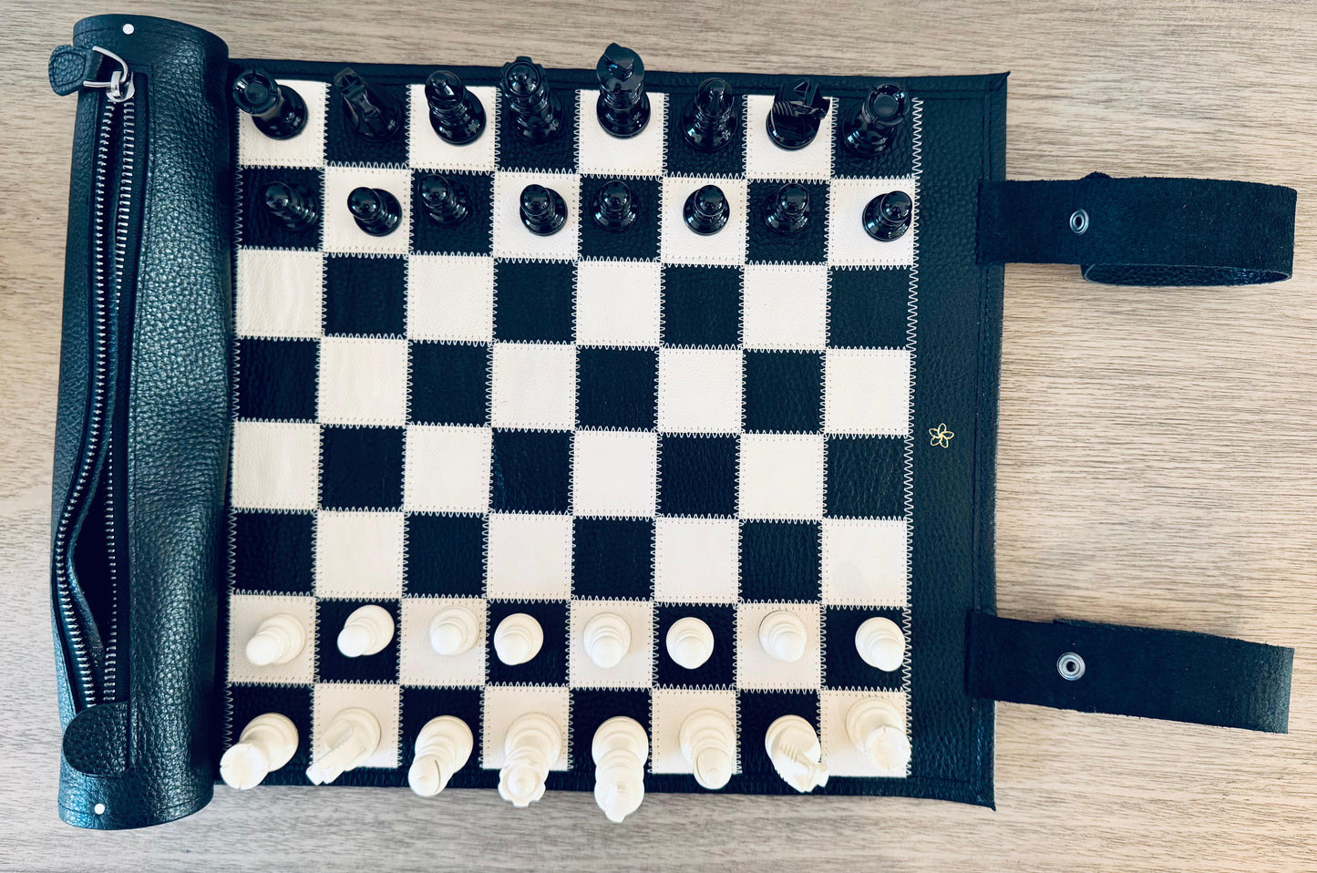 Top view of the Moonlight magnetic leather chess board with integrated storage and handcrafted chess pieces