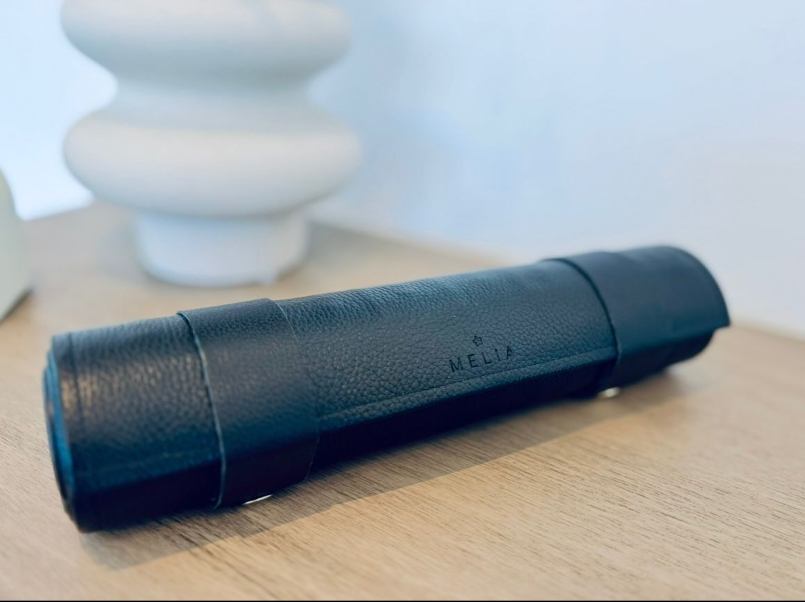 Rolled Moonlight leather chess set showing compact travel case made from premium black floater leather