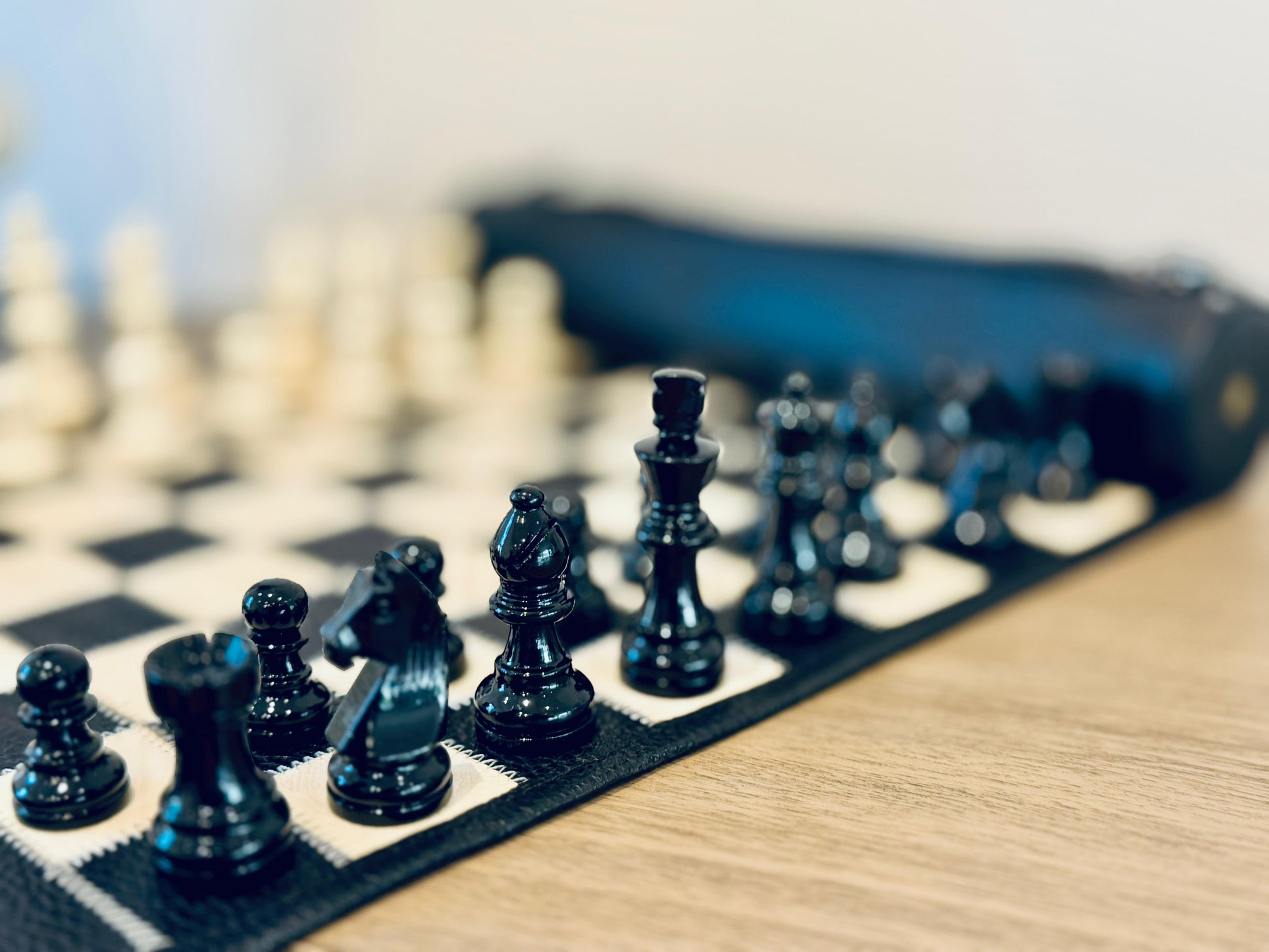 Close-up of handcrafted magnetic chess pieces on the MELIA Moonlight leather chess board