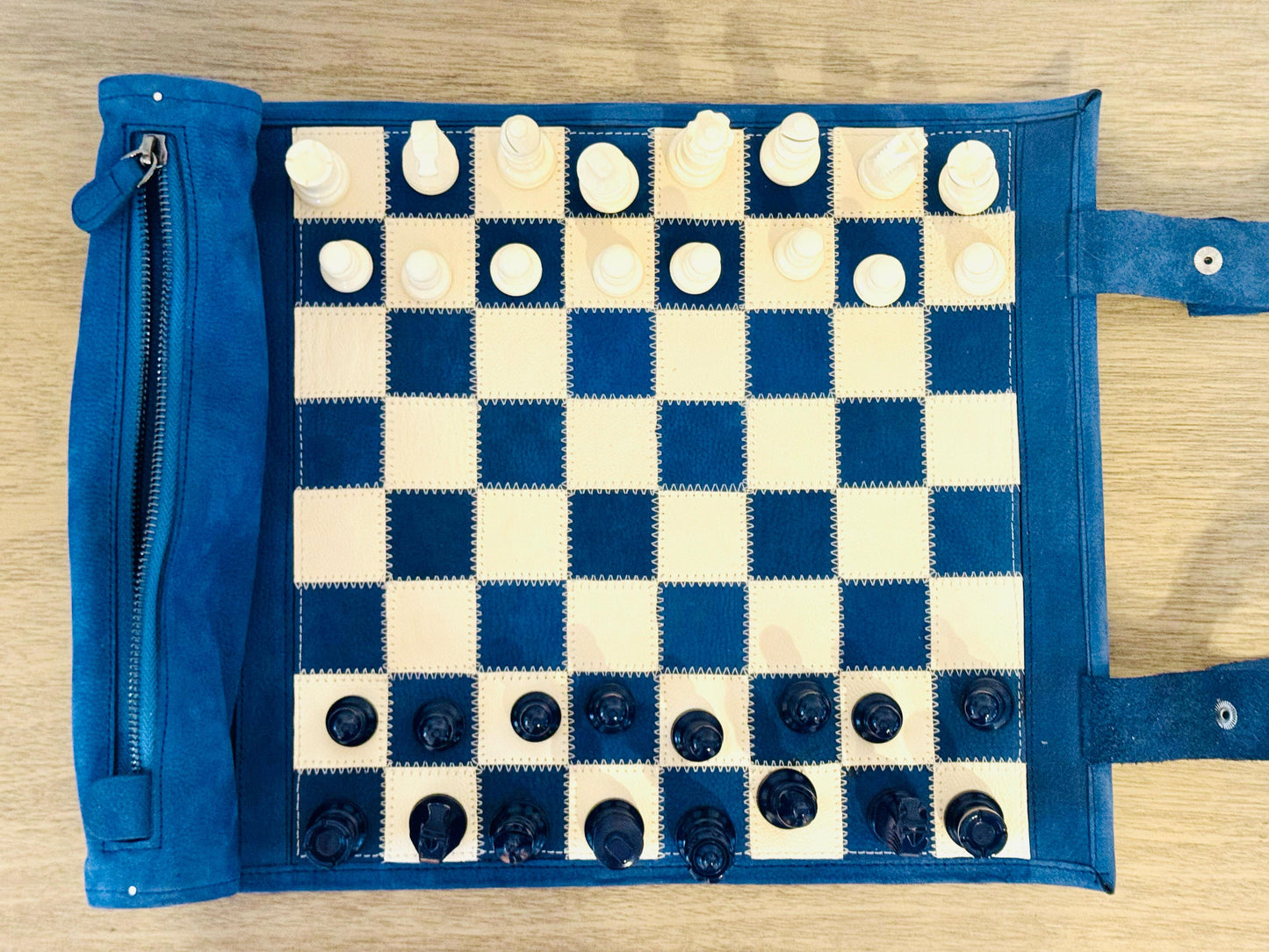 Top view of the Ocean Blue blue-and-ivory magnetic leather chessboard